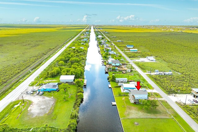 drone / aerial view featuring a water view and a rural view