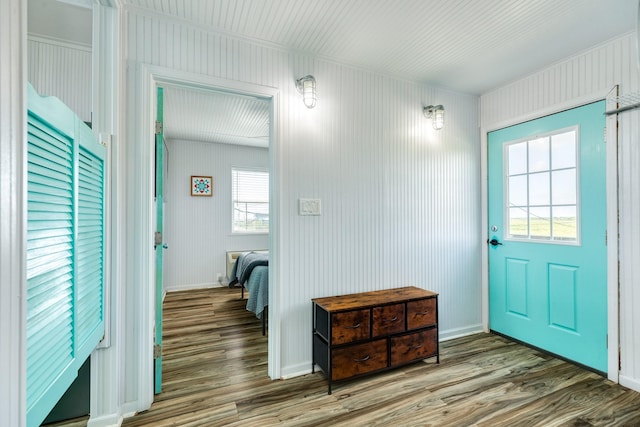 entryway with hardwood / wood-style flooring