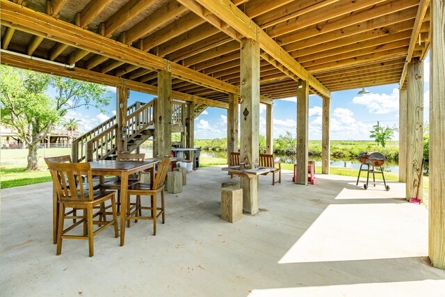 view of patio with a water view