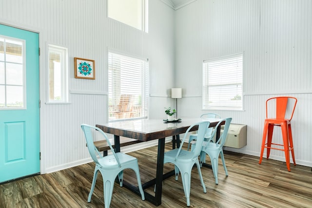 dining area with hardwood / wood-style floors and a healthy amount of sunlight
