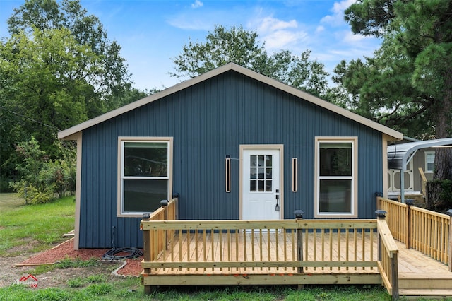 back of property featuring a deck