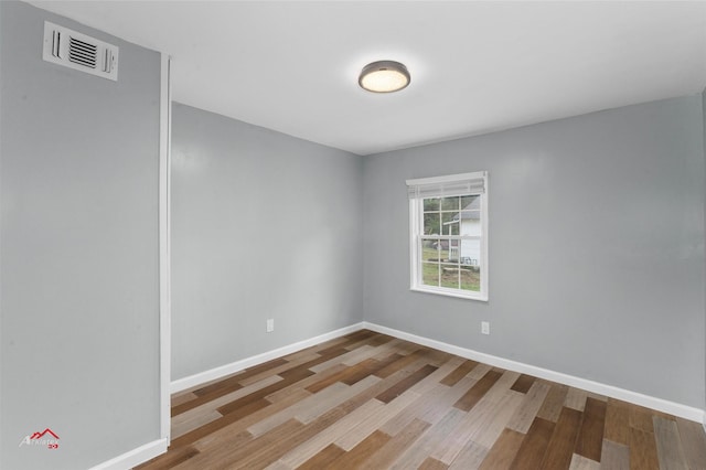 spare room with light hardwood / wood-style floors