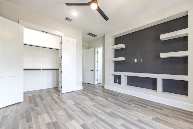 bathroom featuring walk in shower, vanity, tile patterned flooring, and toilet