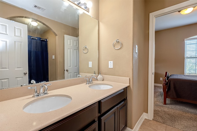 bathroom featuring tile patterned floors, a shower with curtain, and vanity