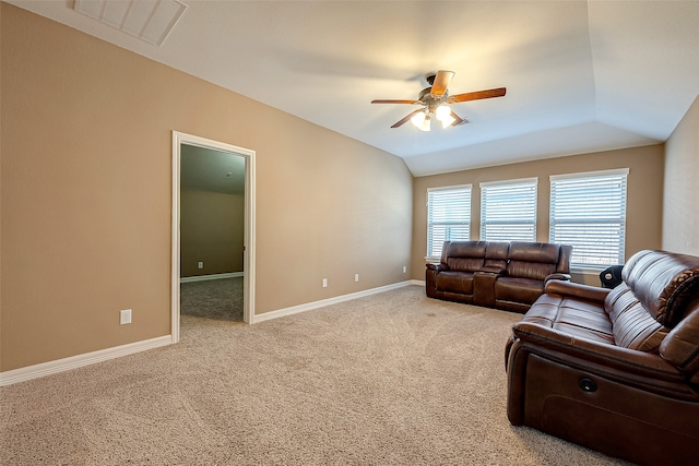 living room with carpet floors, vaulted ceiling, and ceiling fan