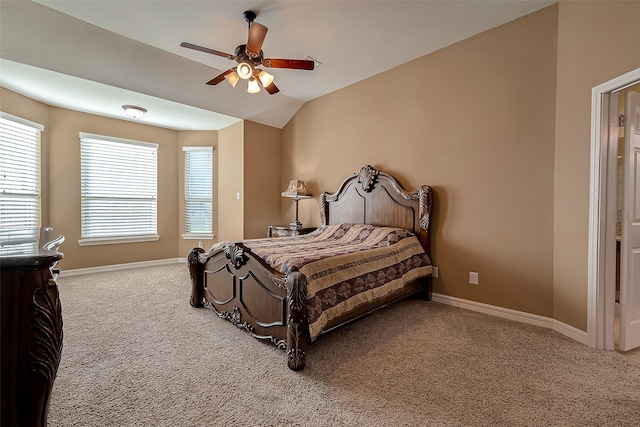 carpeted bedroom with vaulted ceiling and ceiling fan