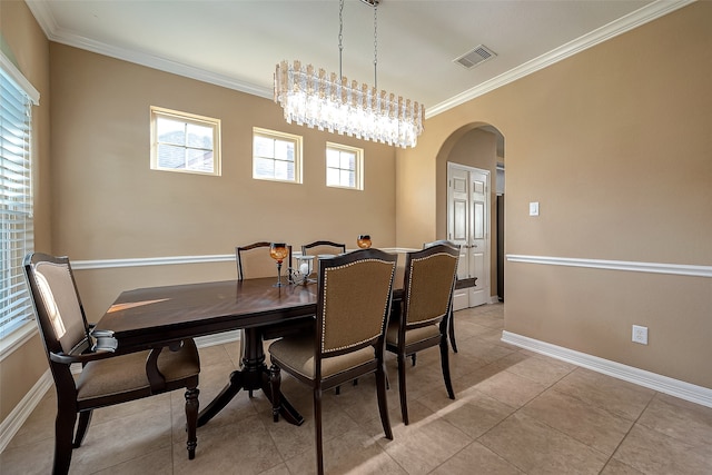 tiled dining area featuring ornamental molding