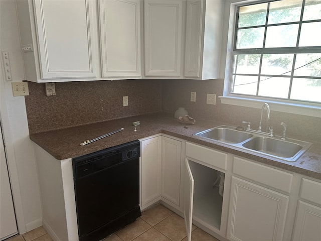 kitchen featuring dishwasher, sink, backsplash, and white cabinetry