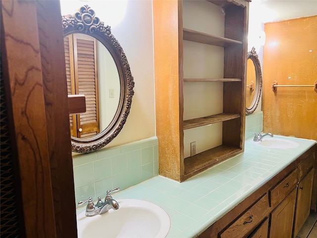 bathroom featuring vanity and tasteful backsplash