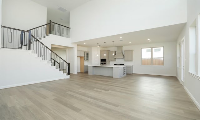 unfurnished living room featuring light wood-type flooring