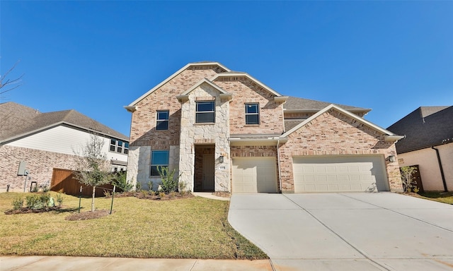 view of front of home with a front yard and a garage