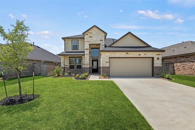 view of front of property with a garage and a front lawn