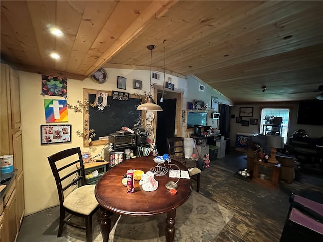 dining area with wood ceiling, concrete flooring, and lofted ceiling