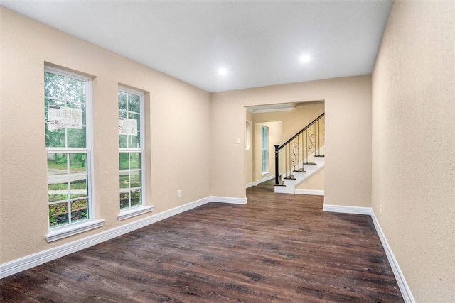 unfurnished room featuring dark hardwood / wood-style floors