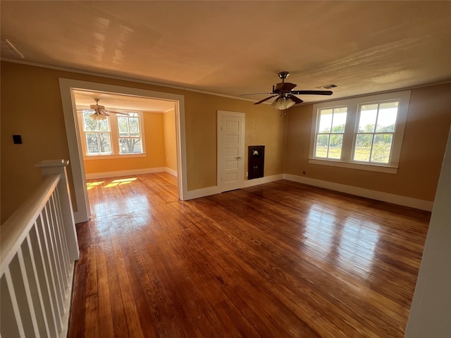 unfurnished living room featuring plenty of natural light, light hardwood / wood-style floors, and ceiling fan