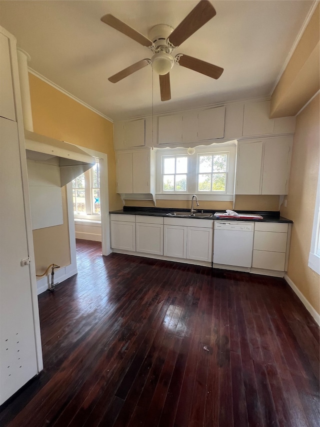 kitchen featuring dark hardwood / wood-style flooring, white dishwasher, white cabinetry, and plenty of natural light