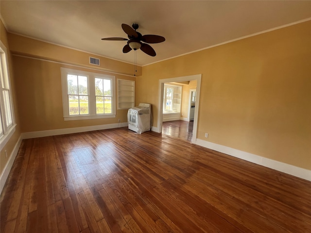 unfurnished living room featuring dark hardwood / wood-style floors, ceiling fan, and ornamental molding