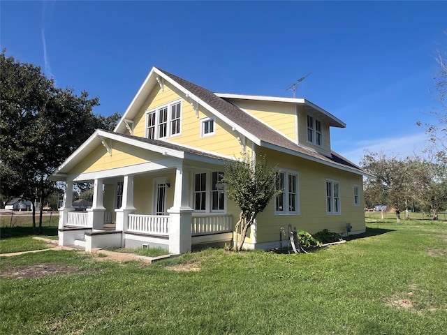 exterior space with a porch and a yard