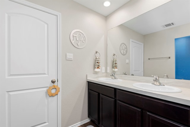 bathroom with dual vanity