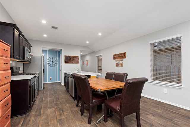 dining space featuring dark wood-type flooring