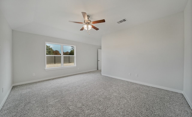 empty room featuring carpet floors and ceiling fan