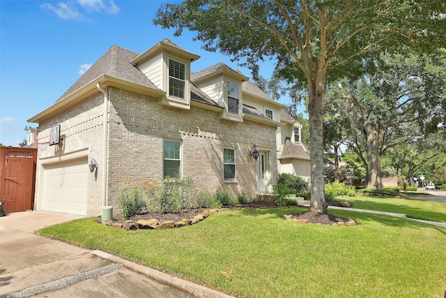 view of front of home featuring a garage and a front lawn