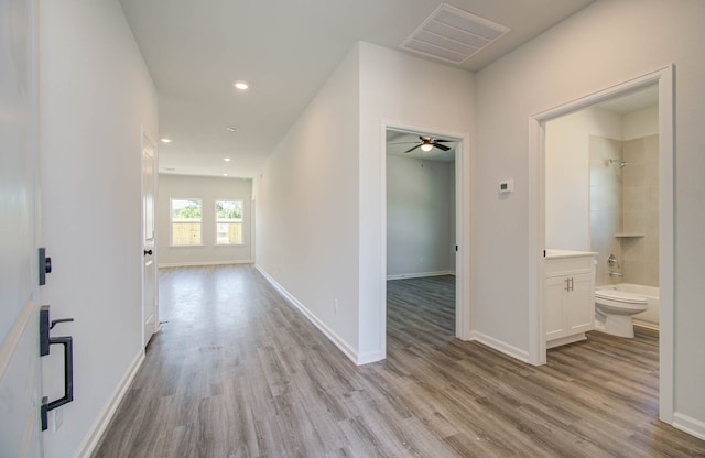 hallway featuring light wood-type flooring