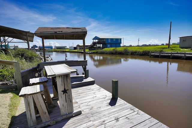 view of dock with a water view