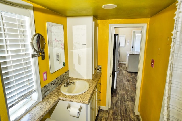 bathroom featuring wood-type flooring and vanity