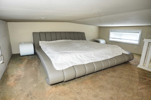 bedroom featuring light carpet, lofted ceiling, and a textured ceiling