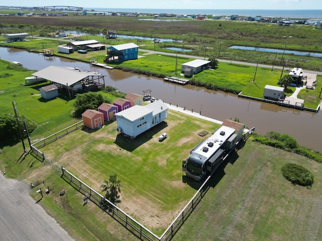 drone / aerial view featuring a rural view and a water view