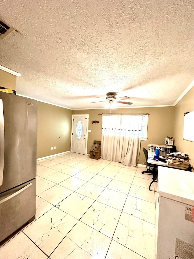 unfurnished office featuring light tile patterned floors, a textured ceiling, ceiling fan, and crown molding