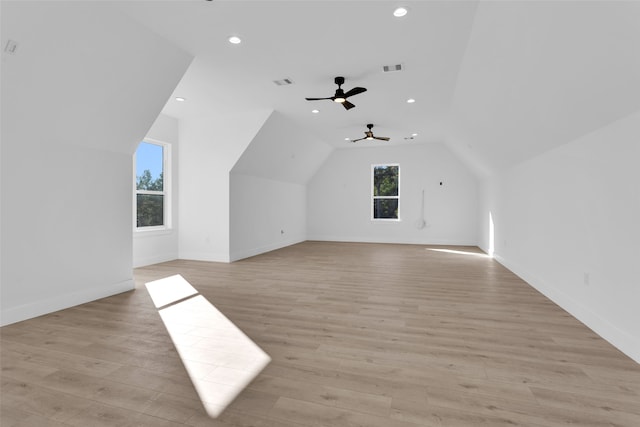 bonus room featuring vaulted ceiling, light hardwood / wood-style flooring, and ceiling fan