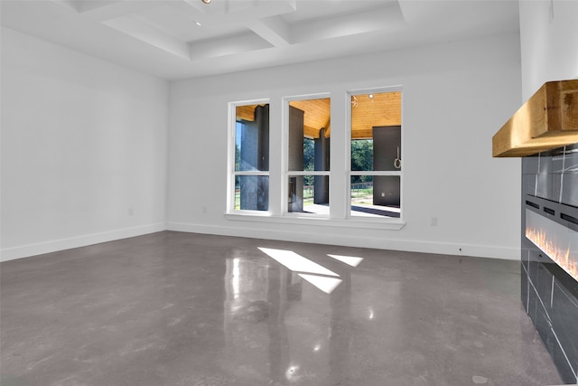 unfurnished living room with a fireplace, beamed ceiling, and coffered ceiling