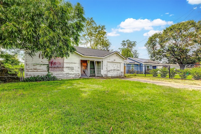 8901 N Main St, Houston, TX 77022 - ranch-style house with an attached garage, fence, driveway, and a front yard