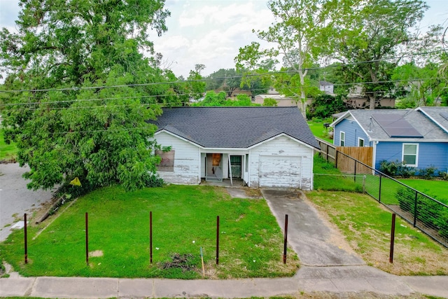 8901 N Main St, Houston, TX 77022 - ranch-style house featuring a garage, a front lawn, fence, and concrete driveway