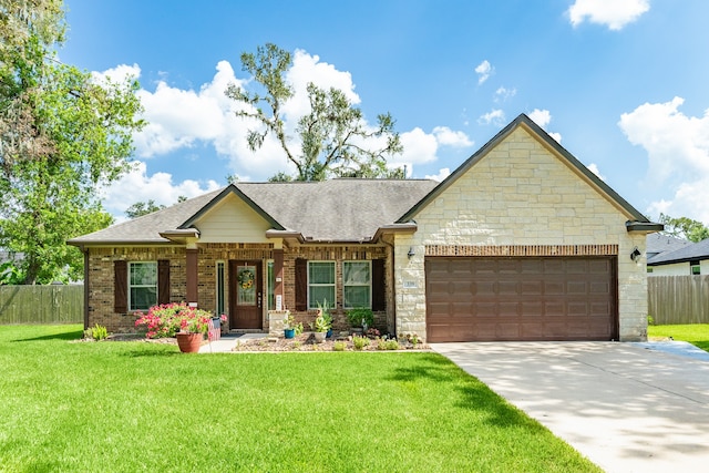 view of front of home featuring a garage and a front yard