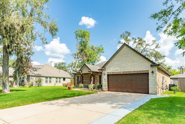 view of front facade featuring a garage, central AC unit, and a front yard