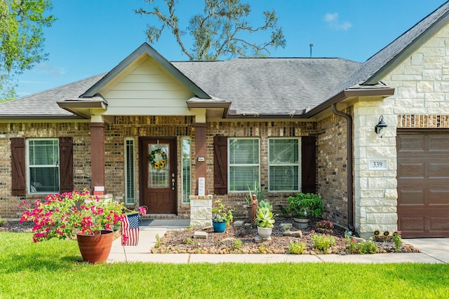 doorway to property with a lawn