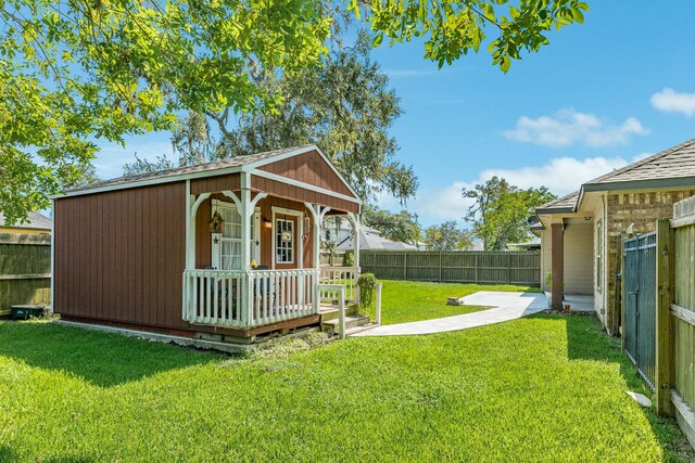 view of outbuilding with a lawn