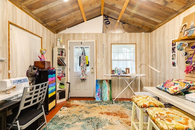 entrance foyer with hardwood / wood-style flooring, vaulted ceiling, wooden ceiling, and wood walls