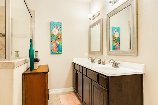 bathroom featuring tile patterned flooring and vanity