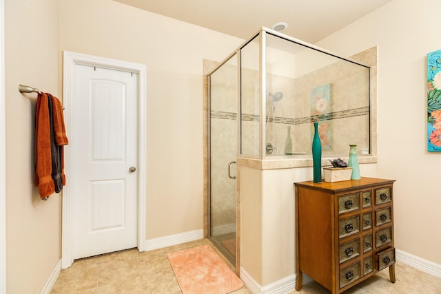 bathroom featuring a shower with door