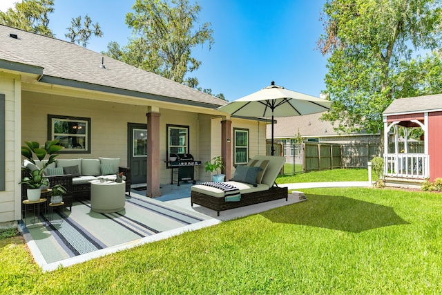 exterior space featuring a yard, a patio area, and an outdoor hangout area