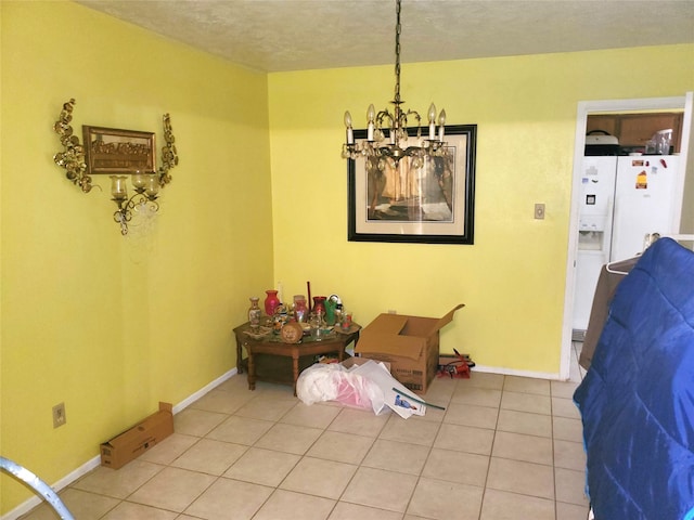 dining space featuring tile patterned flooring and an inviting chandelier