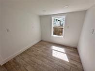 spare room featuring dark hardwood / wood-style floors