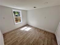 interior space with hardwood / wood-style flooring