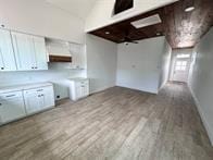 kitchen featuring light hardwood / wood-style floors and white cabinets