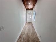 hall with light hardwood / wood-style flooring