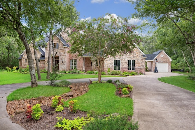 view of front facade featuring a garage and a front lawn